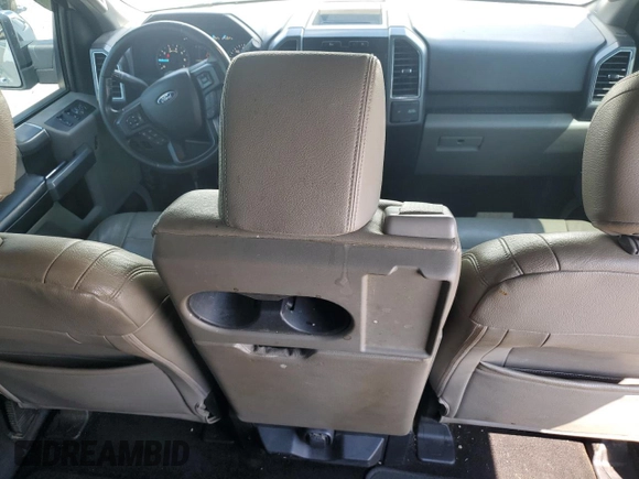 2018 Ford F-150 XL with VIN 1FTEW1EP0JFA28850, listed as a Copart auction lot 63585615 with 210,626 mi miles and Salvage title. Bid and sale history available at DreamBid. Image 8.