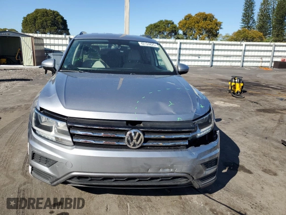 2020 Volkswagen Tiguan SE z VIN 3VV3B7AX8LM036808, wystawiony jako Copart lot #42124825 z przebiegiem 116 297 mil mil oraz Nie do naprawy. Historia ofert i sprzedaży dostępna na DreamBid. Obrazek 5.
