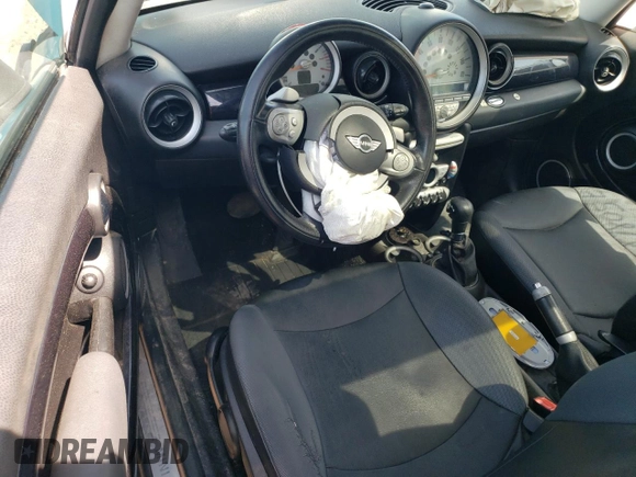 2009 MINI Hardtop with VIN WMWMF33569TW74610, listed as a Copart auction lot 54889805 with 147,533 mi miles and Salvage Title. Bid and sale history available at DreamBid. Image 8.