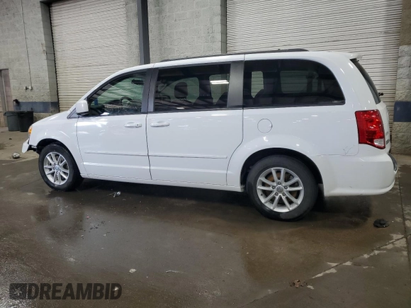 2014 Dodge Grand Caravan SXT with VIN 2C4RDGCG6ER427435, listed as a Copart auction lot 51957355 with 106,078 mi miles and Salvage Title. Bid and sale history available at DreamBid. Image 2.