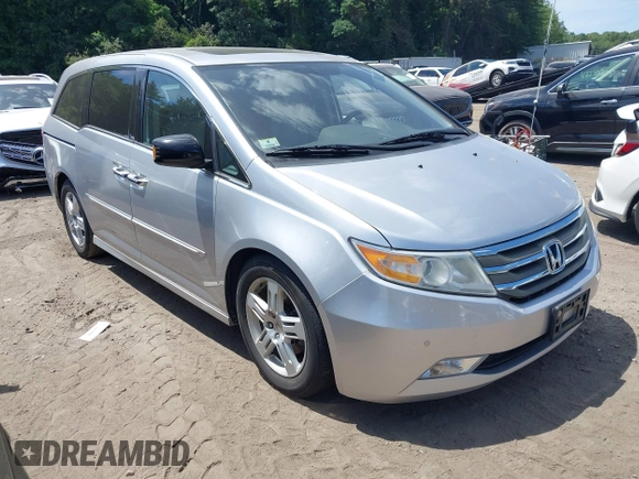 2012 Honda Odyssey Touring with VIN 5FNRL5H9XCB026741, listed as a IAAI auction lot 42808245 with 293,422 mi miles and . Bid and sale history available at DreamBid. Image 1.