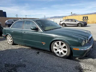 2004 Jaguar XJ with VIN SAJWA71C34SG29498, listed as a Copart auction lot 42653715 with 116,956 mi miles and Salvage Title. Bid and sale history available at carsss.com. Image 4.
