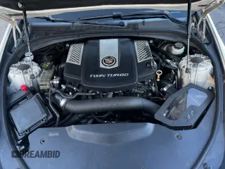 2014 Cadillac CTS Vsport Premium RWD z VIN 1G6AV5S87E0163180, wystawiony jako Copart lot #88171835 z przebiegiem 156 789 mil mil oraz Szkoda całkowita • Salvage title. Historia ofert i sprzedaży dostępna na DreamBid. Obrazek 7.