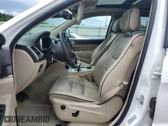 2015 Jeep Grand Cherokee Overland with VIN 1C4RJFCGXFC891616, listed as a Copart auction lot 61386065 with 90,011 mi miles and Salvage title. Bid and sale history available at DreamBid. Image 7.