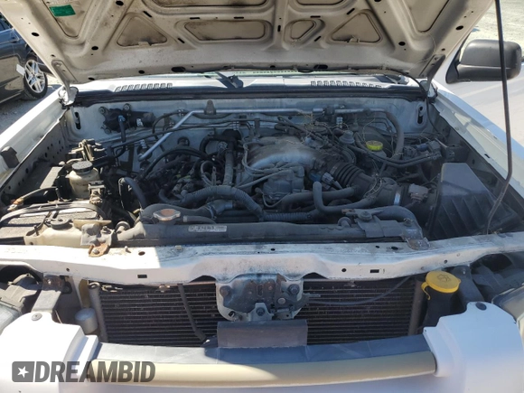 2004 Nissan Frontier XE z VIN 1N6ED27T04C479222, wystawiony jako Copart lot #50957035 z przebiegiem 198 723 mil mil oraz Czysty tytuł • Clean title. Historia ofert i sprzedaży dostępna na DreamBid. Obrazek 11.