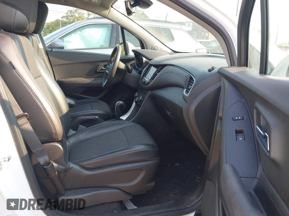 2020 Chevrolet Trax LT with VIN KL7CJLSBXLB073148, listed as a IAAI auction lot 40321540 with 53,972 mi miles and . Bid and sale history available at DreamBid. Image 5.