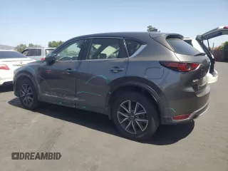 2018 Mazda CX-5 Grand Touring with VIN JM3KFADM3J1389911, listed as a Copart auction lot 60530295 with 103,177 mi miles and Salvage title. Bid and sale history available at DreamBid. Image 2.