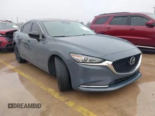2021 Mazda 6 Carbon Edition with VIN JM1GL1WY0M1600414, listed as a IAAI auction lot 41551393 with 36,780 mi miles and . Bid and sale history available at DreamBid. Image 1.