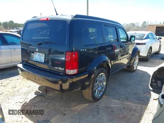 2011 Dodge Nitro Heat with VIN 1D4PU4GX7BW565927, listed as a IAAI auction lot 41803129 with 84,980 mi miles. Bid and sale history available at carsss.com. Image 4.