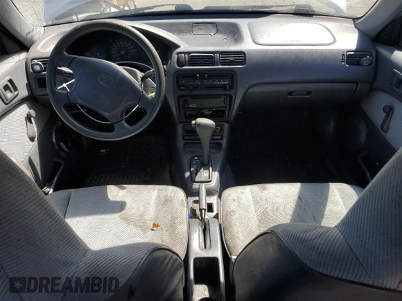 1995 Toyota Tercel DX z VIN JT2EL56E7S7011335, wystawiony jako Copart lot #67978774 z przebiegiem 182 025 mil mil oraz Szkoda całkowita • Salvage title. Historia ofert i sprzedaży dostępna na DreamBid. Obrazek 8.