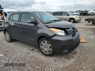 2009 Scion xD with VIN JTKKU10499J045881, listed as a Copart auction lot 60923855 with 125,762 mi miles and Salvage title. Bid and sale history available at DreamBid. Image 4.