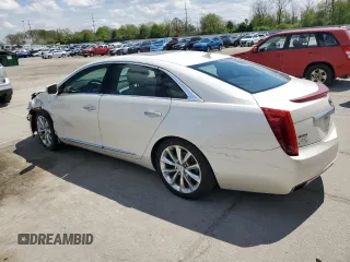 2014 Cadillac XTS Luxury z VIN 2G61M5S33E9193905, wystawiony jako Copart lot #55479605 z przebiegiem 143 006 mil mil oraz Szkoda całkowita • Salvage title. Historia ofert i sprzedaży dostępna na DreamBid. Obrazek 2.
