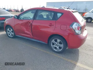 2009 Pontiac Vibe with VIN 5Y2SM67009Z401692, listed as a IAAI auction lot 41769199 with 143,904 mi miles. Bid and sale history available at carsss.com. Image 3.