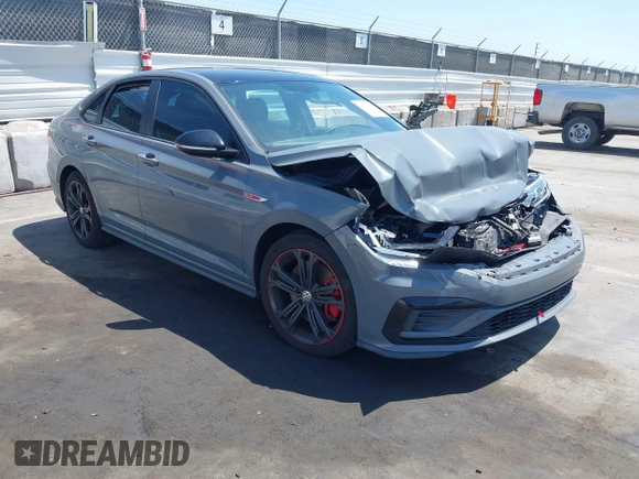 2019 Volkswagen Jetta GLI S z VIN 3VW6T7BU9KM153175, wystawiony jako IAAI lot #42099719 z przebiegiem 90 608 mil mil oraz . Historia ofert i sprzedaży dostępna na DreamBid. Obrazek 1.