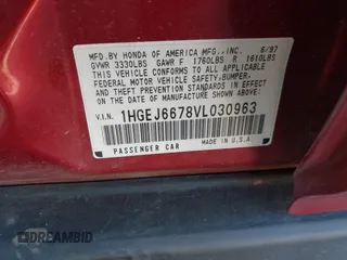 1997 Honda Civic LX with VIN 1HGEJ6678VL030963, listed as a IAAI auction lot 41880866 with 142,472 mi miles. Bid and sale history available at carsss.com. Image 9.