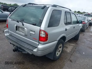 2001 Isuzu Rodeo S with VIN 4S2DM58WX14352481, listed as a IAAI auction lot 42152621 with 162,696 mi miles. Bid and sale history available at carsss.com. Image 4.