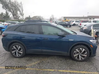 2023 Volkswagen ID.4 Pro z VIN 1V2CMPE88PC028158, wystawiony jako IAAI lot #41538391 z przebiegiem 7159 mil mil oraz . Historia ofert i sprzedaży dostępna na DreamBid. Obrazek 14.