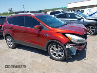 2015 Ford Escape Titanium with VIN 1FMCU0J92FUA77772, listed as a IAAI auction lot 42498981 with 130,449 mi miles and . Bid and sale history available at DreamBid. Image 1.