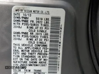 2014 Infiniti QX70 with VIN JN8CS1MW7EM412867, listed as a Copart auction lot 60054195 with 148,064 mi miles and Salvage title. Bid and sale history available at DreamBid. Image 13.
