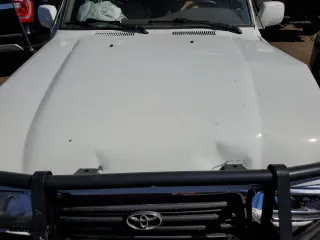 1997 Toyota Land Cruiser with VIN JT3HJ85J2V0180979, listed as a Copart auction lot 73216714 with 239,444 mi miles and Salvage Title. Bid and sale history available at carsss.com. Image 13.