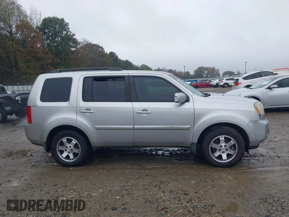 2010 Honda Pilot Touring with VIN 5FNYF3H89AB005861, listed as a IAAI auction lot 40828747 with 275,757 mi miles and . Bid and sale history available at DreamBid. Image 13.