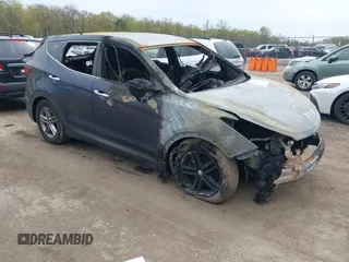 2018 Hyundai Santa Fe 2.4L z VIN 5XYZTDLB1JG563136, wystawiony jako IAAI lot #42009184 z przebiegiem Nie podano mil oraz . Historia ofert i sprzedaży dostępna na DreamBid. Obrazek 1.