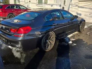 2016 BMW M6 z VIN WBS6E9C57GG437138, wystawiony jako Copart lot #45290525 z przebiegiem 58 645 mil mil oraz Tytuł czysty. Historia ofert i sprzedaży dostępna na DreamBid. Obrazek 4.