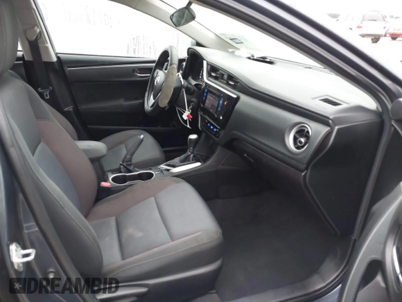 2018 Toyota Corolla L z VIN 5YFBURHE7JP831763, wystawiony jako IAAI lot #41539485 z przebiegiem 95 495 mil mil oraz . Historia ofert i sprzedaży dostępna na DreamBid. Obrazek 5.