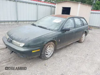 1999 Saturn SW z VIN 1G8ZK8271XZ314797, wystawiony jako IAAI lot #41843385 z przebiegiem 91 599 mil mil oraz . Historia ofert i sprzedaży dostępna na DreamBid. Obrazek 2.