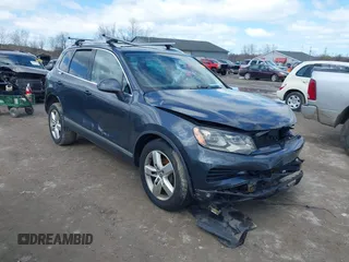 2013 Volkswagen Touareg Lux with VIN WVGEF9BP4DD006851, listed as a IAAI auction lot 41983791 with 115,551 mi miles and . Bid and sale history available at DreamBid. Image 1.