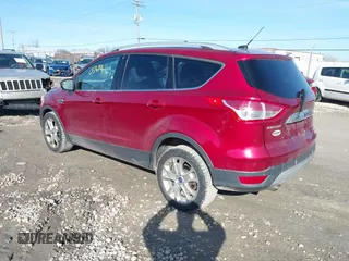 2015 Ford Escape Titanium z VIN 1FMCU9J9XFUC75357, wystawiony jako IAAI lot #41705474 z przebiegiem 198 381 mil mil oraz . Historia ofert i sprzedaży dostępna na DreamBid. Obrazek 3.