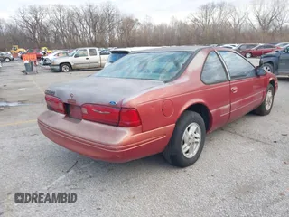 1997 Ford Thunderbird LX with VIN 1FALP62W8VH161871, listed as a IAAI auction lot 41018103 with 138,915 mi miles and . Bid and sale history available at DreamBid. Image 4.