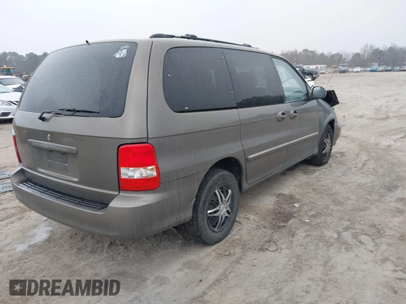 2005 Kia Sedona LX with VIN KNDUP132056674430, listed as a IAAI auction lot 41553321 with 136,734 mi miles. Bid and sale history available at carsss.com. Image 4.