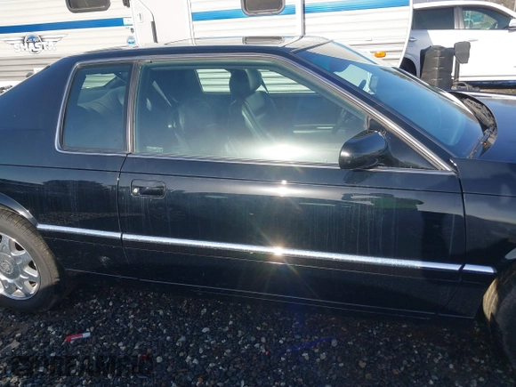 1999 Cadillac Eldorado Touring z VIN 1G6ET129XXU603042, wystawiony jako IAAI lot #41699955 z przebiegiem 81 704 mil mil oraz . Historia ofert i sprzedaży dostępna na DreamBid. Obrazek 14.