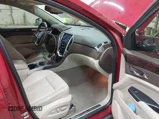 2014 Cadillac SRX Performance Collection z VIN 3GYFNCE30ES596415, wystawiony jako IAAI lot #42329771 z przebiegiem 71 620 mil mil oraz . Historia ofert i sprzedaży dostępna na DreamBid. Obrazek 5.