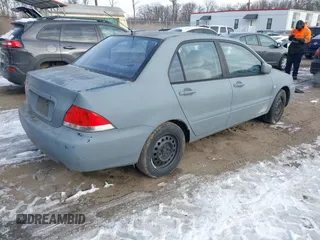 2006 Mitsubishi Lancer ES with VIN JA3AJ26E06U005019, listed as a IAAI auction lot 41381773 with 174,034 mi miles. Bid and sale history available at carsss.com. Image 4.