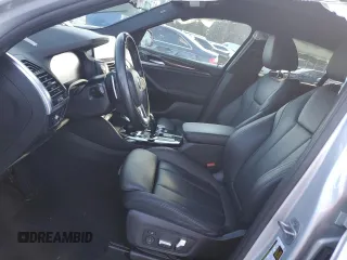 2021 BMW X4 xDrive30i with VIN 5UX2V1C04M9G96019, listed as a Copart auction lot 87287934 with Not provided miles and Salvage title. Bid and sale history available at DreamBid. Image 7.