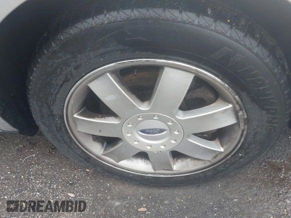 2005 Ford Five Hundred SE z VIN 1FAFP23115G106256, wystawiony jako IAAI lot #42263958 z przebiegiem Nie podano mil oraz . Historia ofert i sprzedaży dostępna na DreamBid. Obrazek 11.