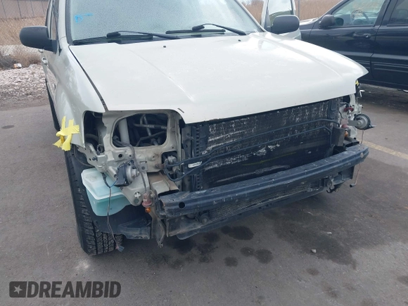 2005 Mercury Mariner Convenience z VIN 4M2YU57Z85DJ28652, wystawiony jako IAAI lot #41524903 z przebiegiem 228 497 mil mil oraz . Historia ofert i sprzedaży dostępna na DreamBid. Obrazek 6.