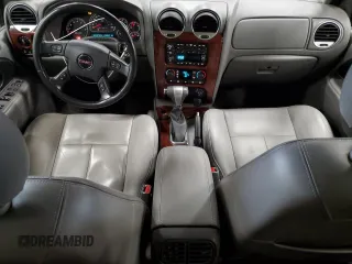 2006 GMC Envoy SLE z VIN 1GKDT13S062263876, wystawiony jako Copart lot #60245185 z przebiegiem 156 567 mil mil oraz Czysty tytuł • Clean title. Historia ofert i sprzedaży dostępna na DreamBid. Obrazek 8.