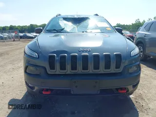 2014 Jeep Cherokee Trailhawk z VIN 1C4PJMBSXEW273520, wystawiony jako IAAI lot #42569063 z przebiegiem 137 585 mil mil oraz . Historia ofert i sprzedaży dostępna na DreamBid. Obrazek 12.