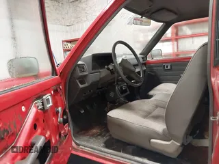 1987 Toyota Pickup with VIN JT4RN50R8H0221202, listed as a IAAI auction lot 40500429 with 304,229 mi miles and . Bid and sale history available at DreamBid. Image 8.