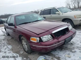 2004 Ford Crown Victoria LX with VIN 2FAFP74W14X128791, listed as a IAAI auction lot 41405101 with 137,091 mi miles. Bid and sale history available at carsss.com. Image 1.