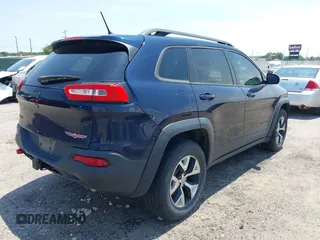 2015 Jeep Cherokee Trailhawk with VIN 1C4PJMBS3FW704622, listed as a IAAI auction lot 42465702 with 96,831 mi miles and . Bid and sale history available at DreamBid. Image 4.