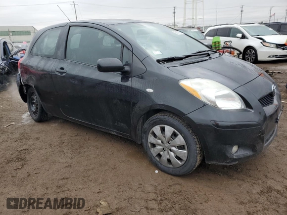 2011 Toyota Yaris with VIN JTDJT4K37B5339113, listed as a Copart auction lot 82474554 with 148,800 mi miles and Salvage Title. Bid and sale history available at carsss.com. Image 4.