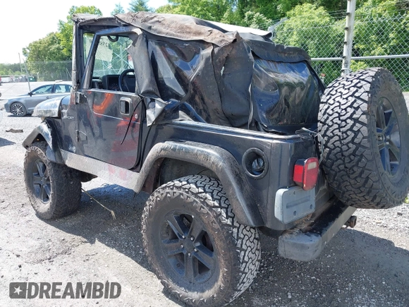 2003 Jeep Wrangler Sport z VIN 1J4FA49S53P317779, wystawiony jako IAAI lot #42388780 z przebiegiem Nie podano mil oraz . Historia ofert i sprzedaży dostępna na DreamBid. Obrazek 3.