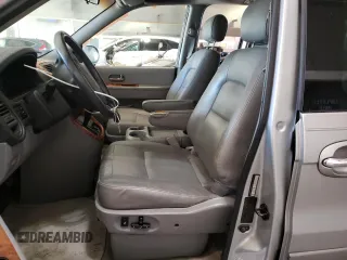 2004 Kia Sedona LX with VIN KNDUP131946569536, listed as a Copart auction lot 82963493 with 119,901 mi miles and Clean Title. Bid and sale history available at carsss.com. Image 7.