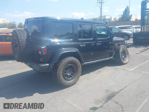 2022 Jeep Wrangler Unlimited Rubicon with VIN 1C4HJXFN0NW242903, listed as a IAAI auction lot 41448636 with 28,007 mi miles and . Bid and sale history available at DreamBid. Image 4.
