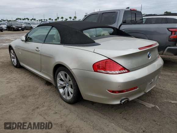 2009 BMW 6 Series 650i with VIN WBAEB53599CX64829, listed as a Copart auction lot 75694824 with 0 mi miles and Salvage Title. Bid and sale history available at carsss.com. Image 2.