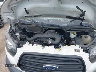 2018 Ford Transit z VIN 1FTBW3XMXJKB24221, wystawiony jako IAAI lot #42425978 z przebiegiem 77 666 mil mil oraz . Historia ofert i sprzedaży dostępna na DreamBid. Obrazek 10.